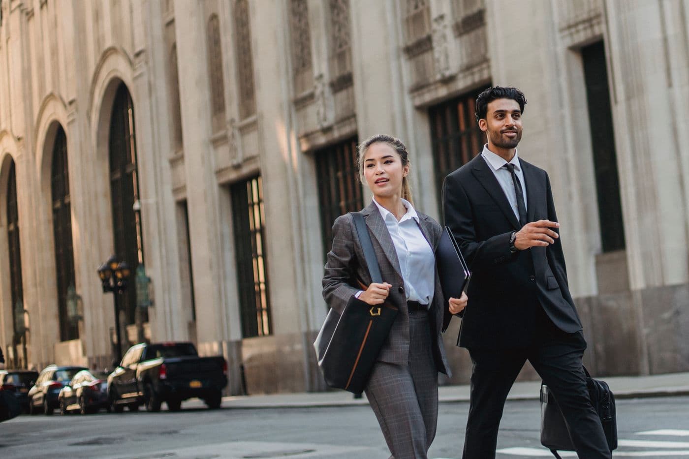 Two business professionals walking together with purpose